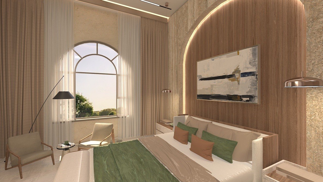 Guest room seating by an arched window